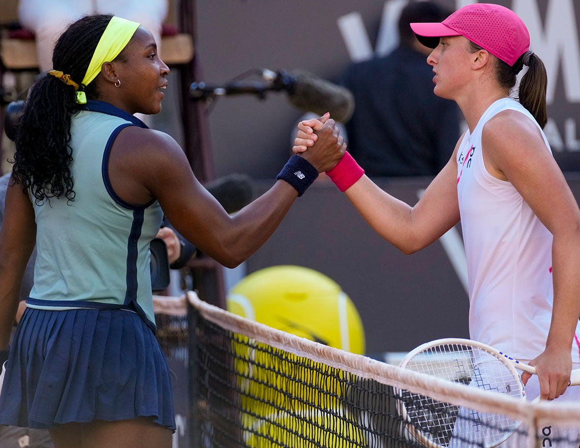 Coco Gauff and Iga Swiatek, among the top players in women's tennis rankings, shake hands at net