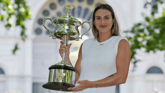Aryna Sabalenka poses with her Australian Open trophy.