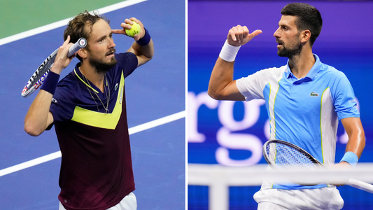 Two men raise their hands on court in arthur ashe 