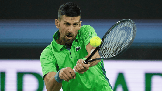 Novak Djokovic hits a backhand at Indian Wells.