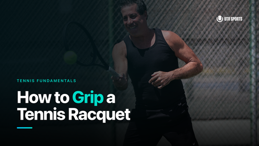 Man smiling and hitting a tennis ball