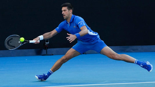 Novak Djokovic stretches for a ball during an exhbition match at the 2024 Australian Open, where he could win his 11th Australian Open men's singles title