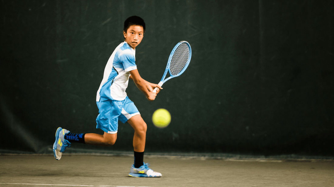 A boy hits a backhand in New York at SPORTIME.