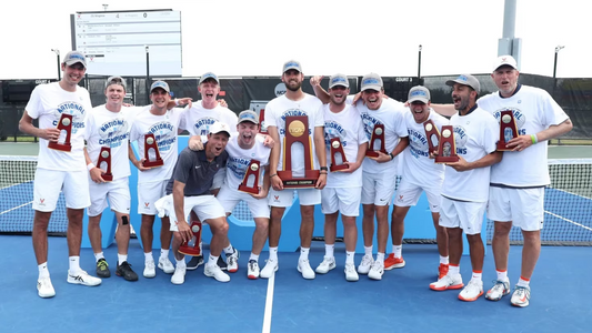 The UVA men's tennis team pose with their NCAA trophies.