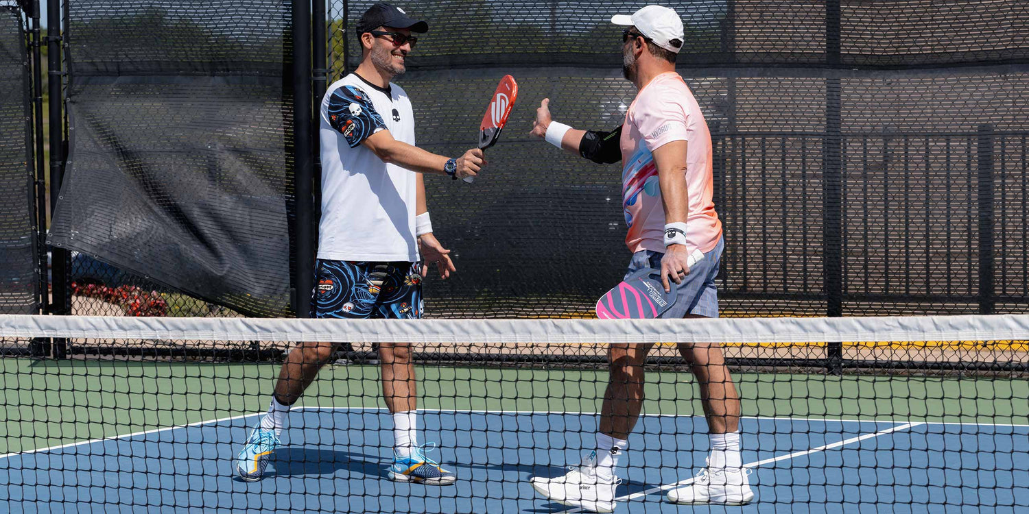 UTR Sports Pickleball players celebrate winning a point before partnership announcement with USA Pickleball