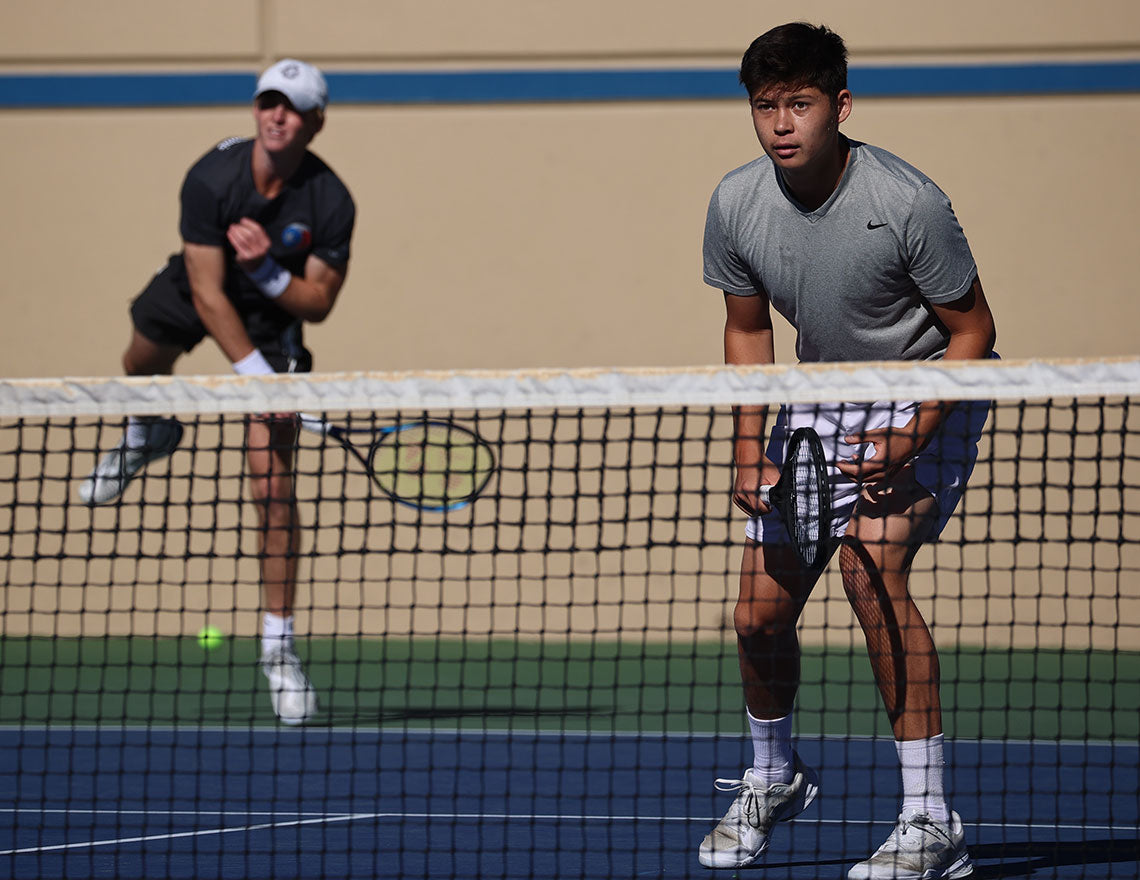 Two boys compete in UTR Sports junior tennis event to improve the u18 boys tennis rankings next to their names