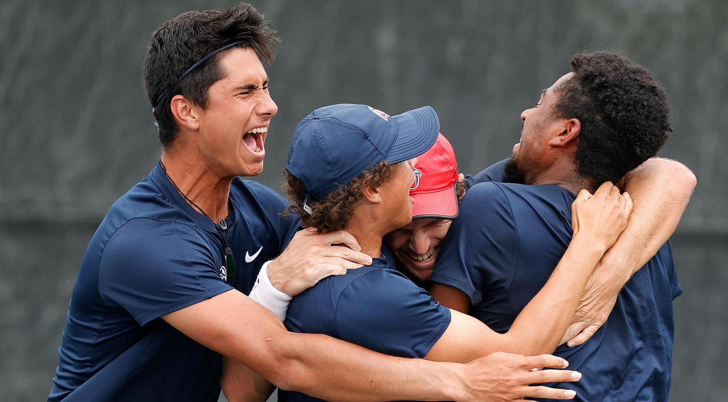 Liberty men's tennis players celebrate their Universal Tennis NIT Championship at the inaugural college tennis championship hosted by Universal Tennis