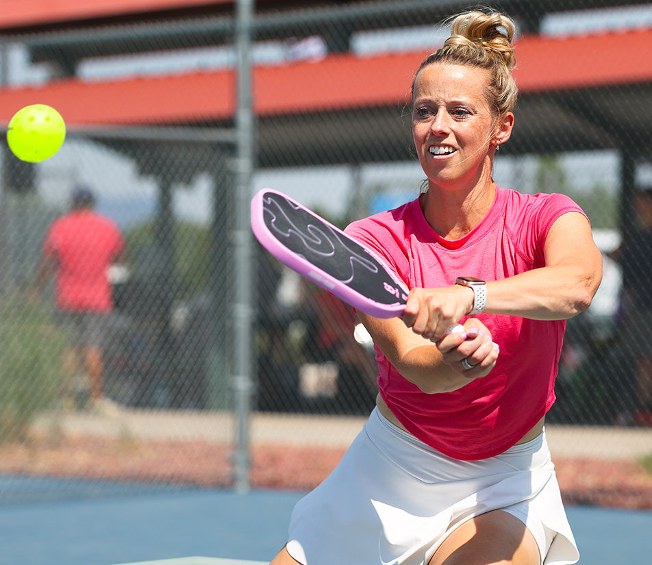 Woman plays pickleball with UTR Sports while improving her UTR Pickleball Rating