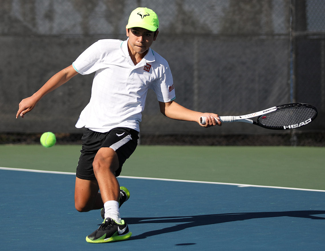 Boy hits a forehand while climbing up the u16 boys rankings with UTR Sports